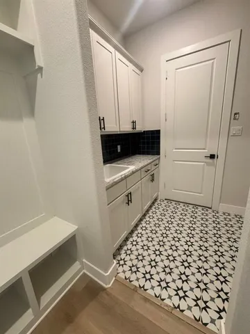 a bathroom with a sink and a shower
