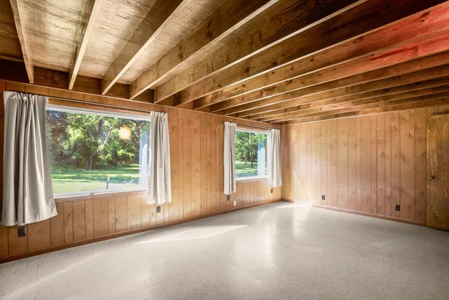 a view of livingroom with furniture and floor to ceiling window