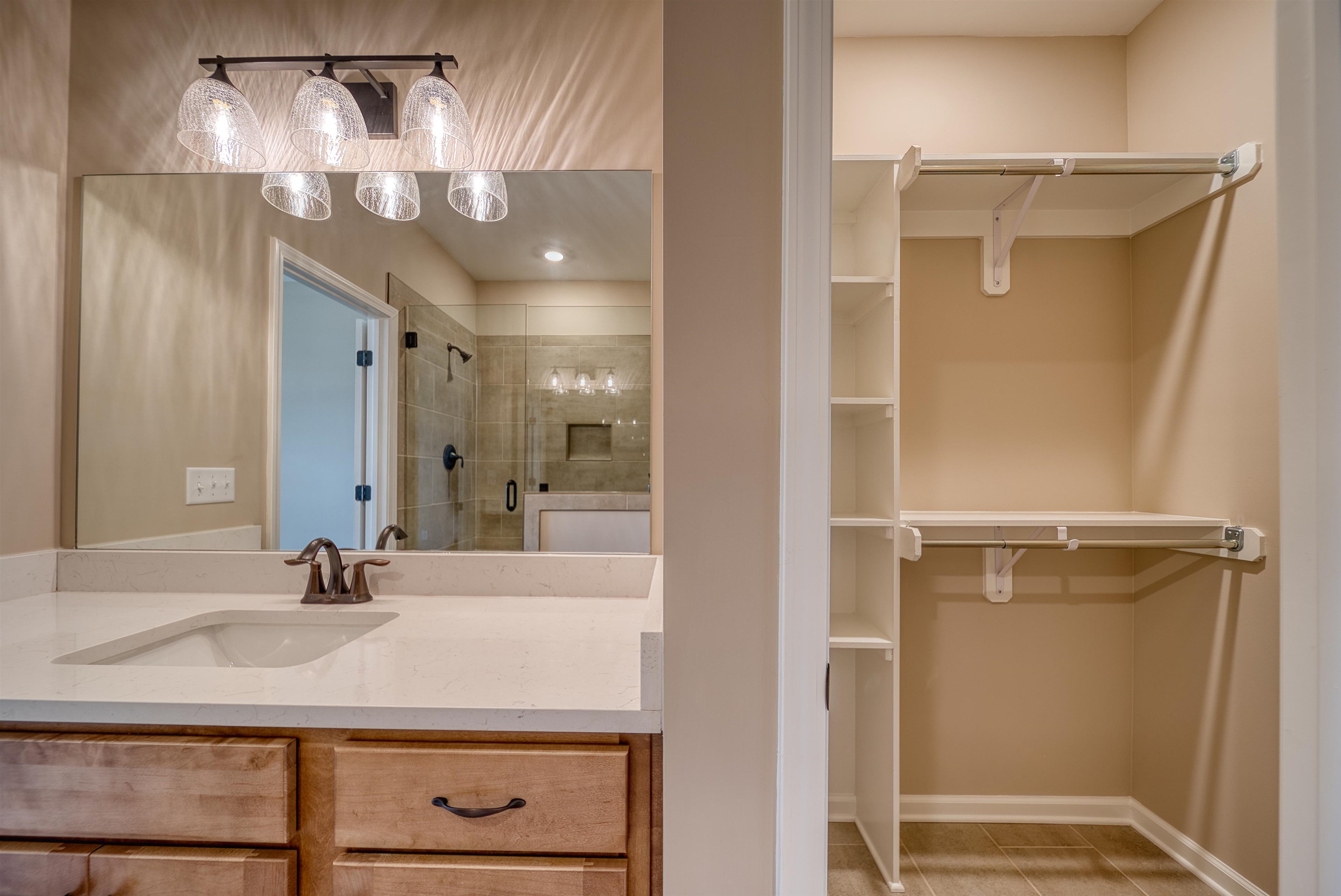 170 Como Lane Atoka, TN 38004 - Photo 13 of 40 Full bathroom with a walk in closet, a stall shower, and vanity
