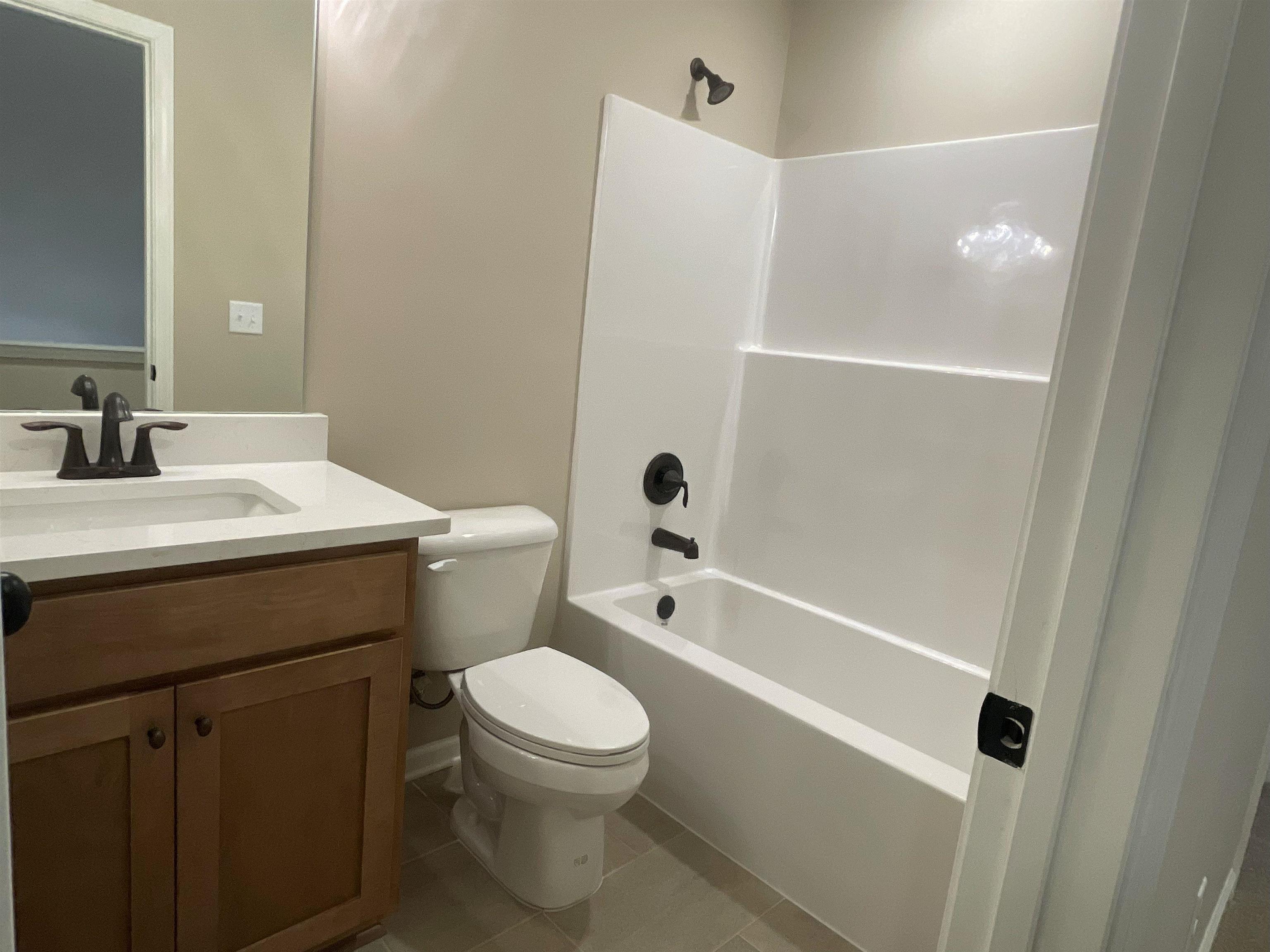 170 Como Lane Atoka, TN 38004 - Photo 15 of 27 a bathroom with a sink a toilet and shower