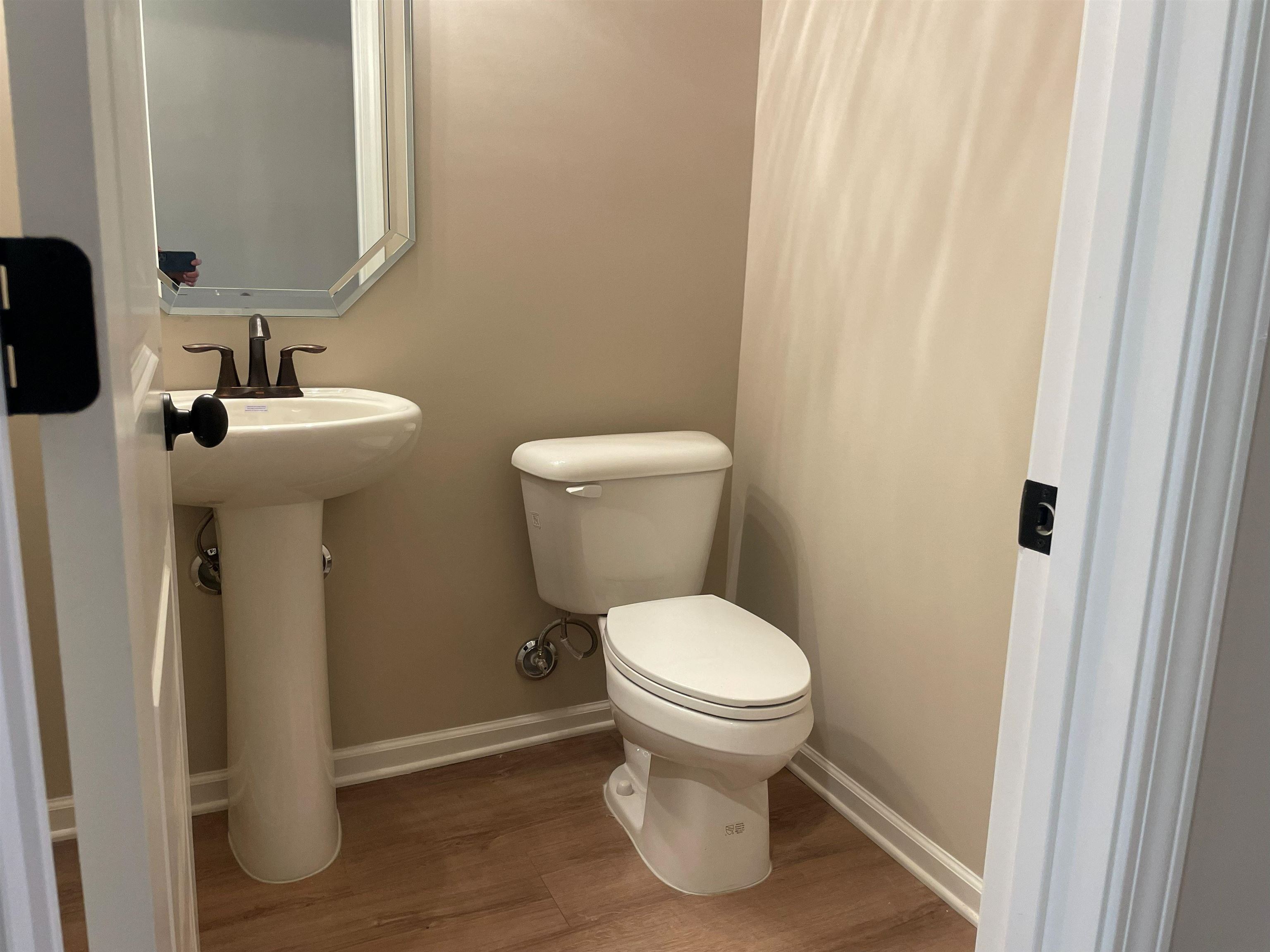 170 Como Lane Atoka, TN 38004 - Photo 16 of 27 Half bathroom featuring baseboards and wood finished floors