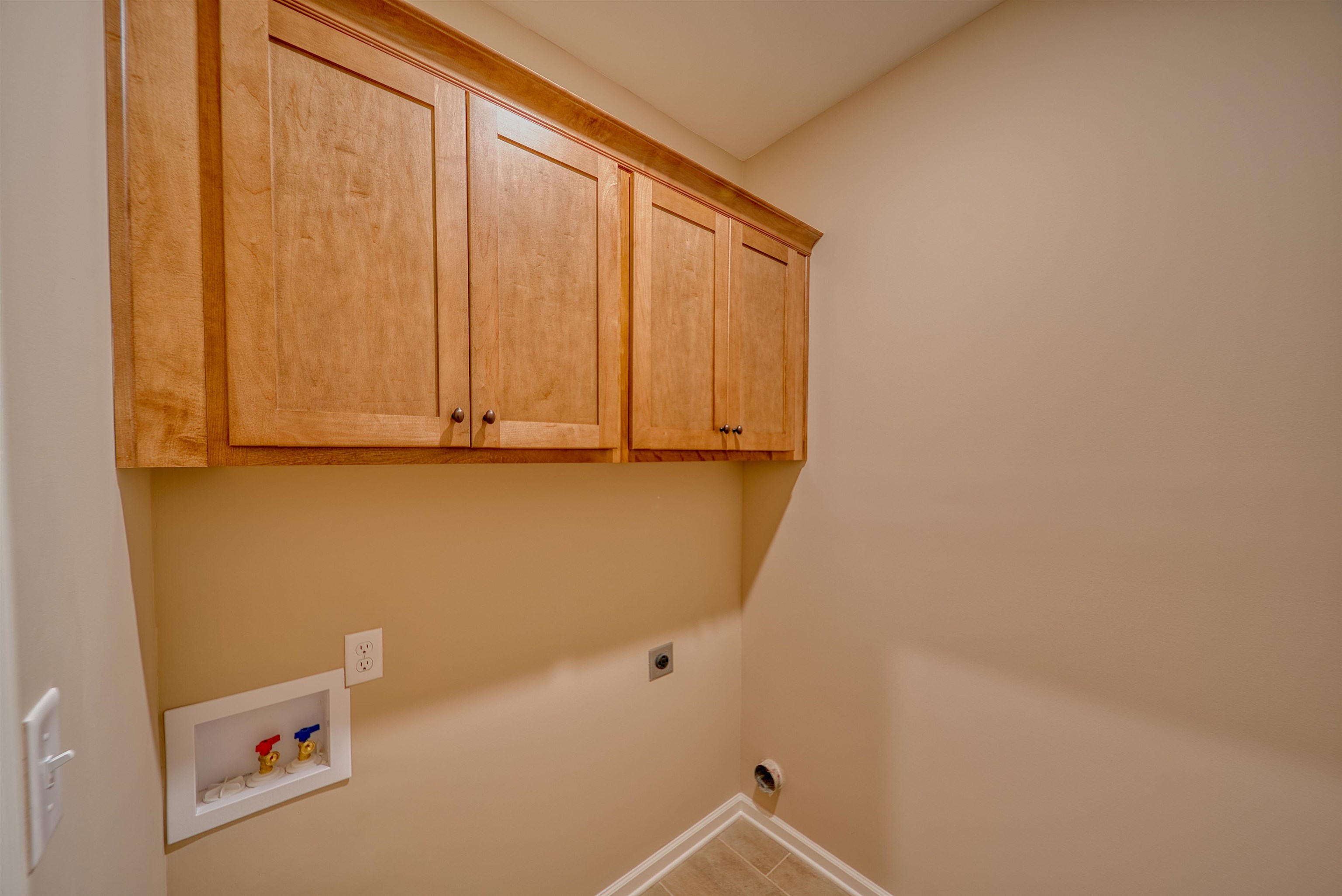 170 Como Lane Atoka, TN 38004 - Photo 16 of 40 Laundry room with hookup for a washing machine, cabinet space, and hookup for an electric dryer
