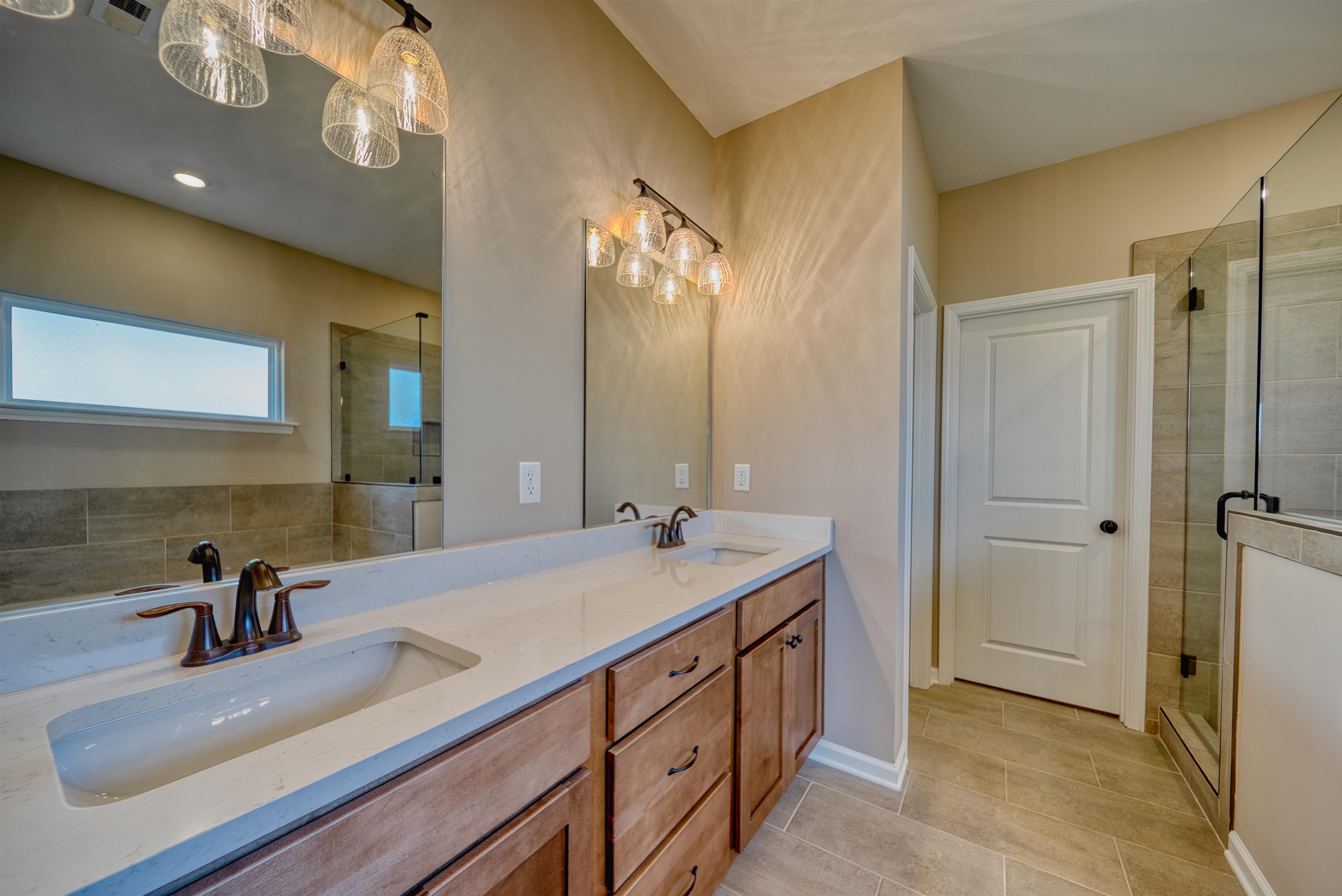 170 Como Lane Atoka, TN 38004 - Photo 20 of 40 Bathroom featuring a shower stall and double vanity