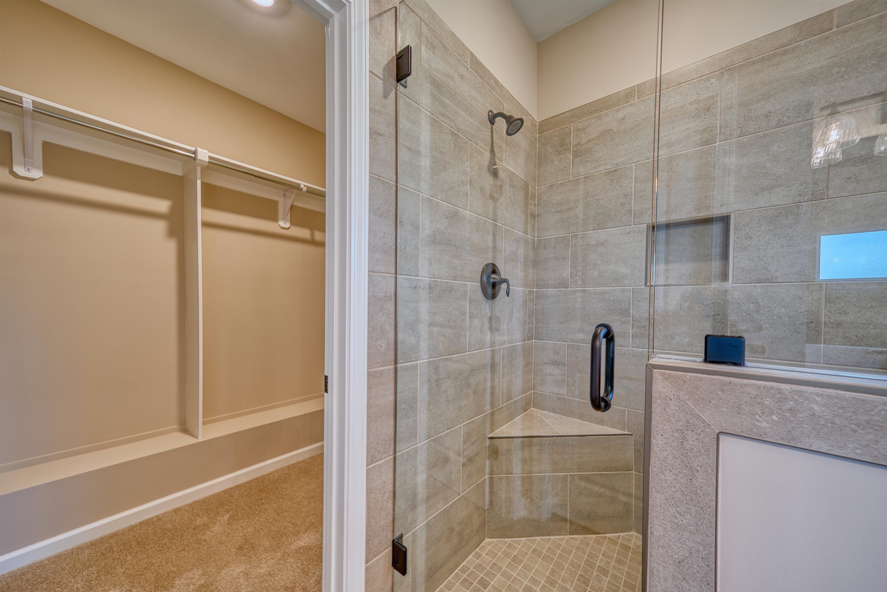 170 Como Lane Atoka, TN 38004 - Photo 22 of 40 Full bathroom with a walk in closet, a shower stall, and carpet floors