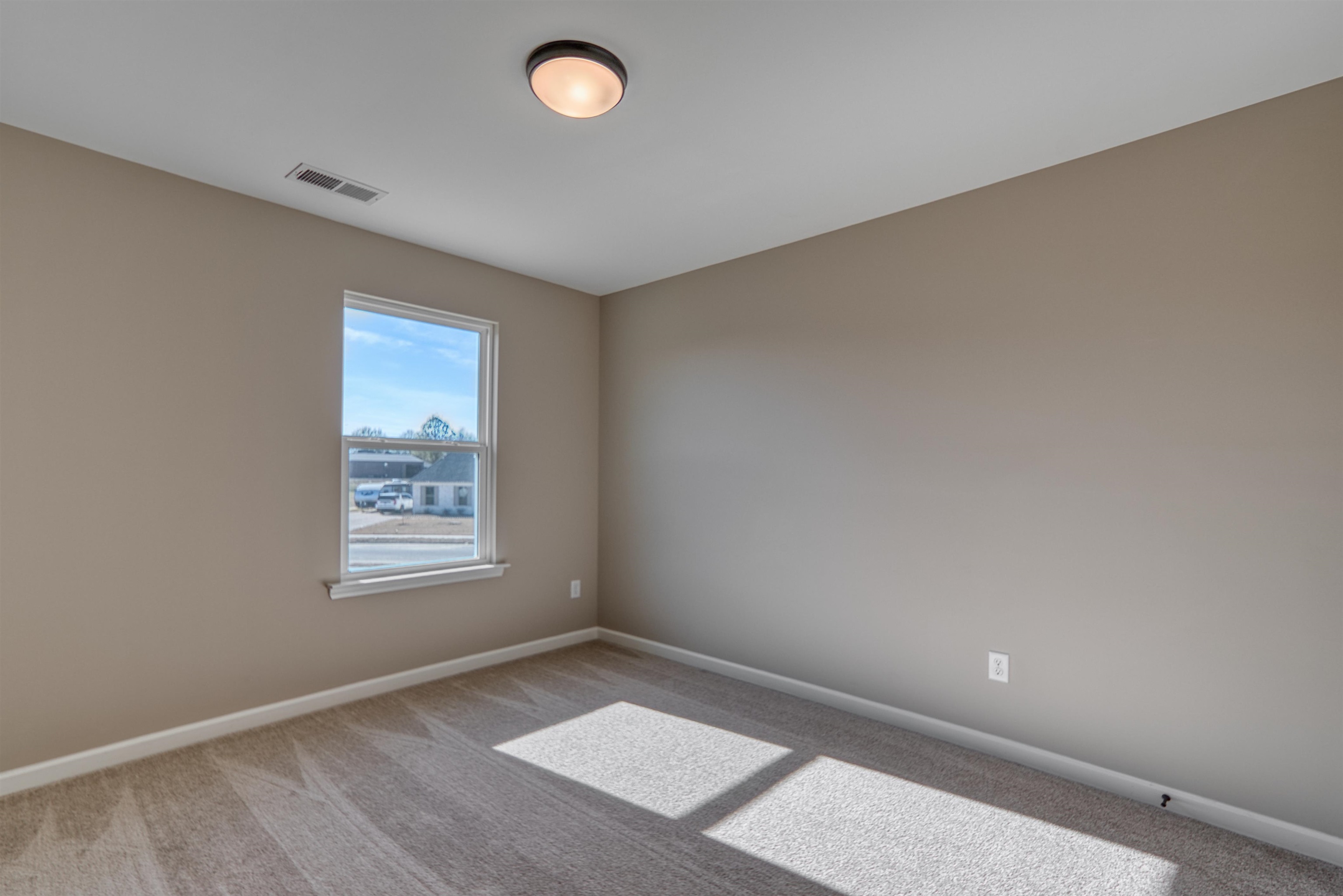 170 Como Lane Atoka, TN 38004 - Photo 28 of 40 Spare room featuring baseboards and light carpet