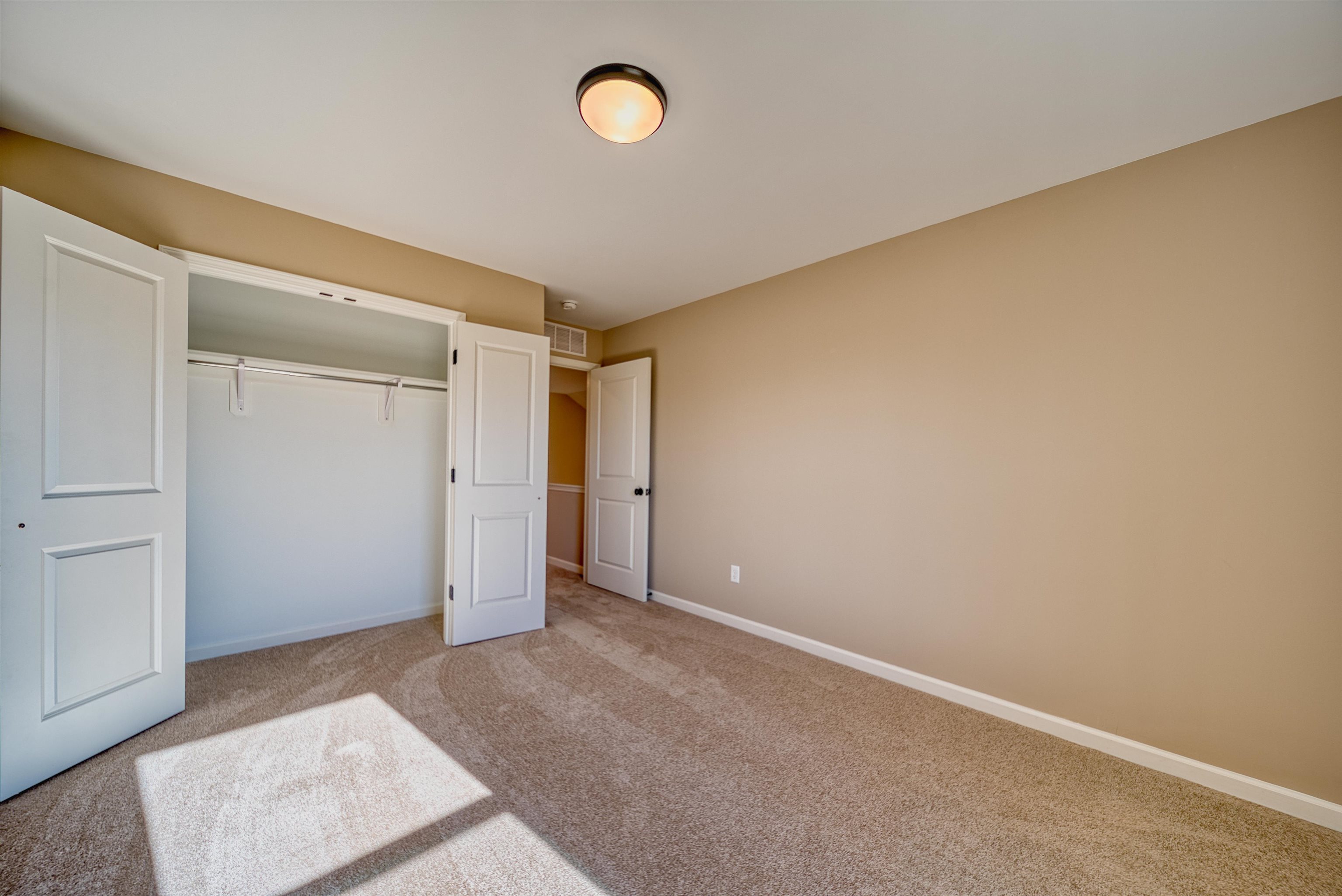 170 Como Lane Atoka, TN 38004 - Photo 29 of 40 Unfurnished bedroom with a closet and light colored carpet