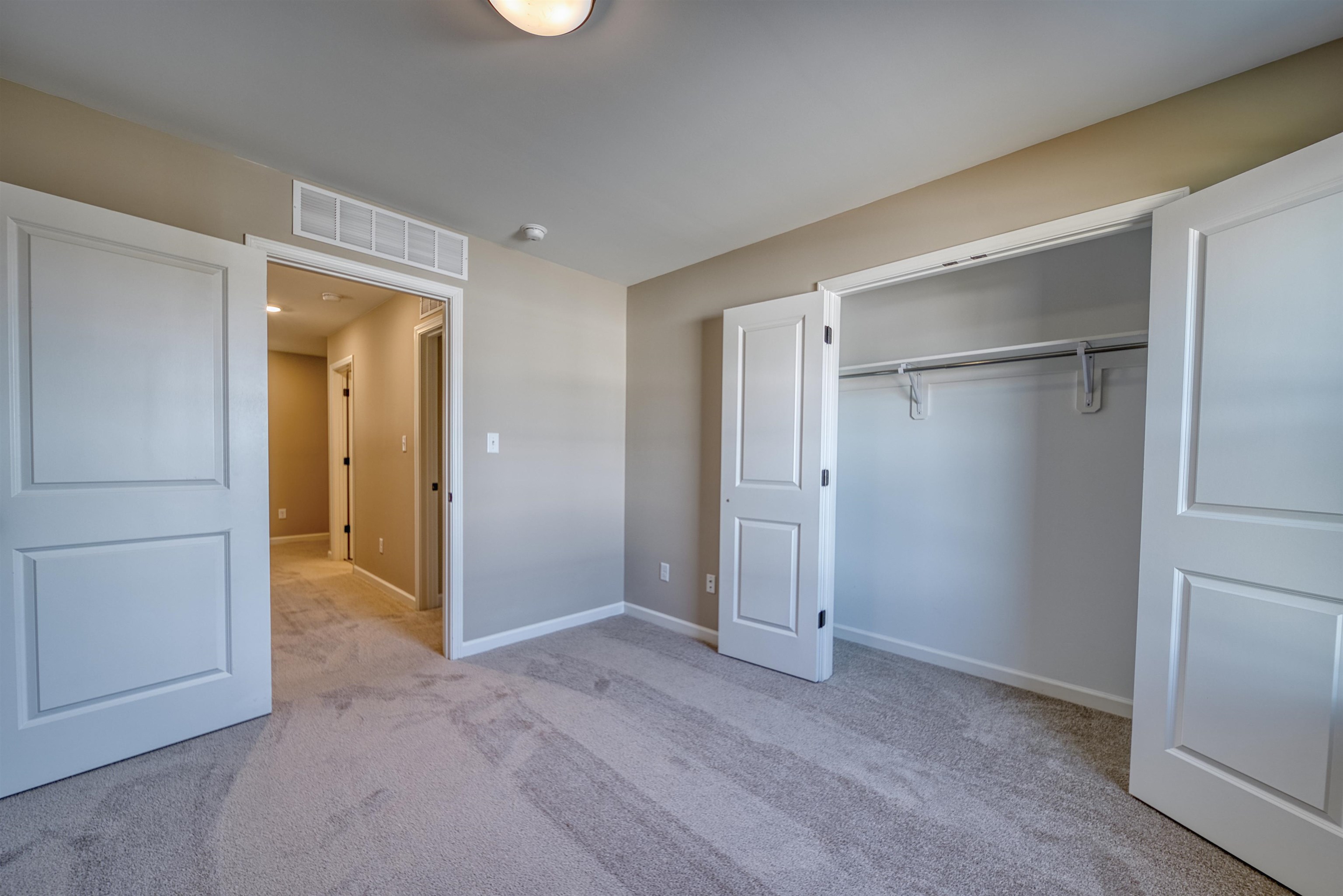 170 Como Lane Atoka, TN 38004 - Photo 30 of 40 Unfurnished bedroom with light colored carpet and a closet