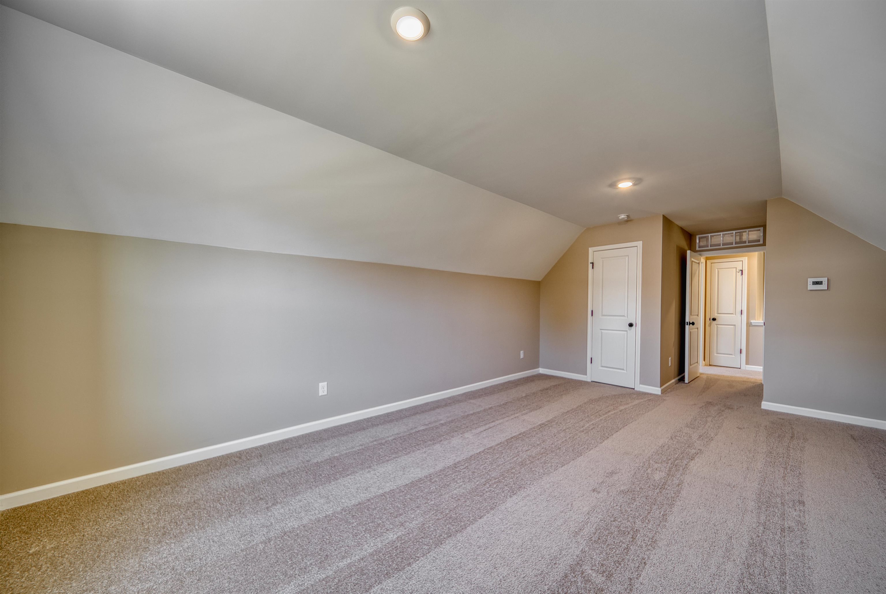 170 Como Lane Atoka, TN 38004 - Photo 32 of 40 Additional living space featuring light colored carpet and baseboards