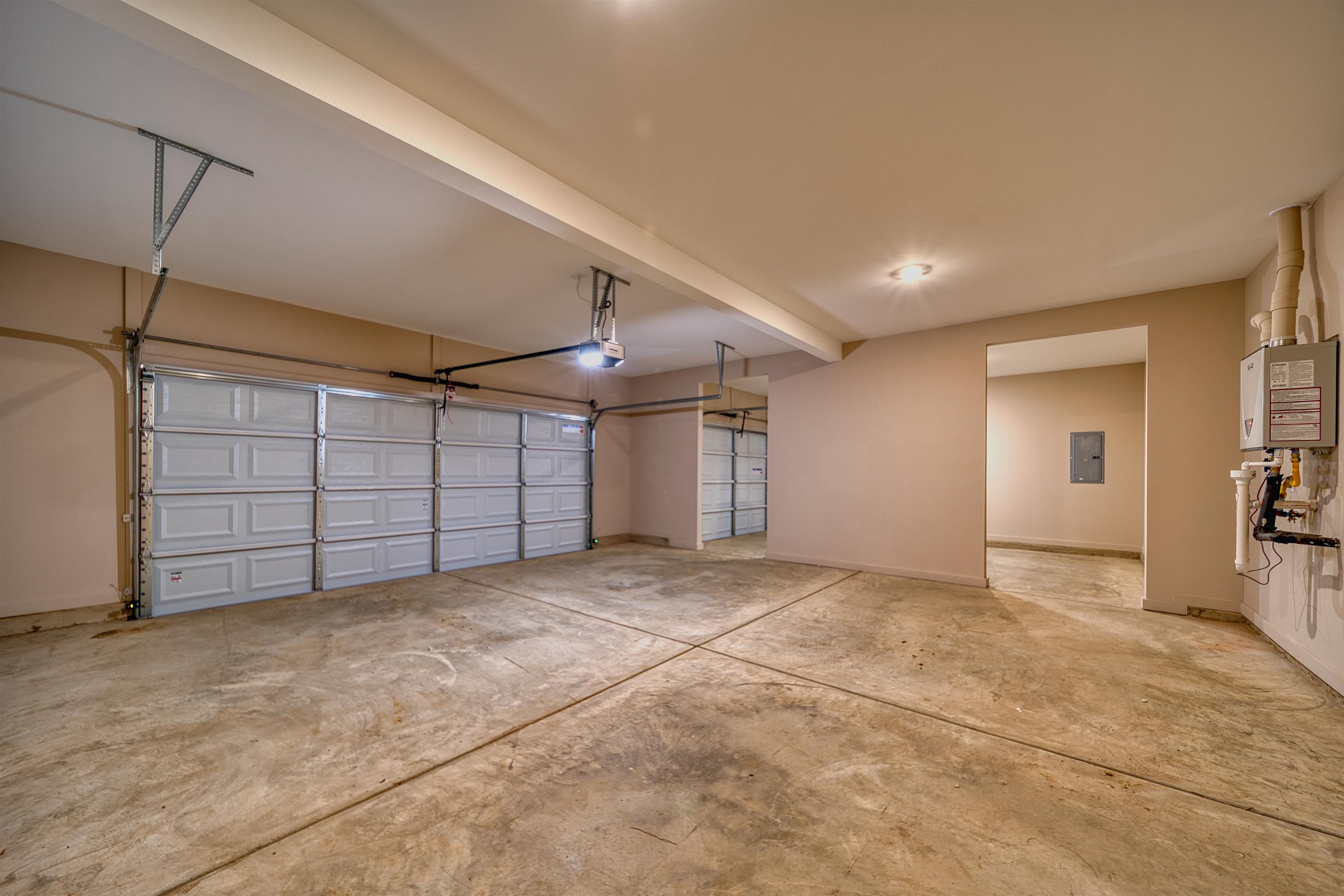 170 Como Lane Atoka, TN 38004 - Photo 33 of 40 Garage featuring baseboards and electric panel