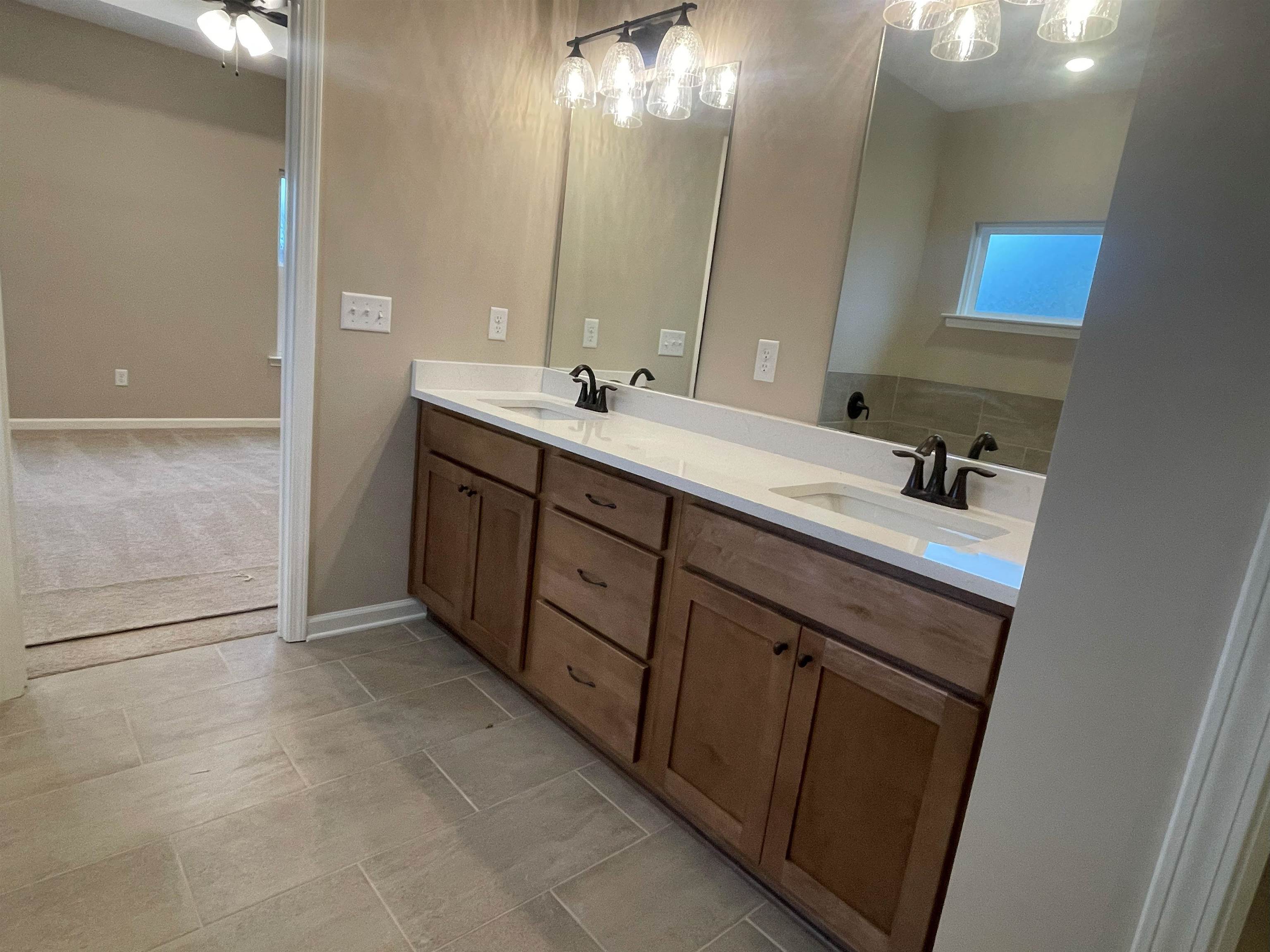 170 Como Lane Atoka, TN 38004 - Photo 9 of 27 Full bath featuring double vanity and light tile patterned flooring