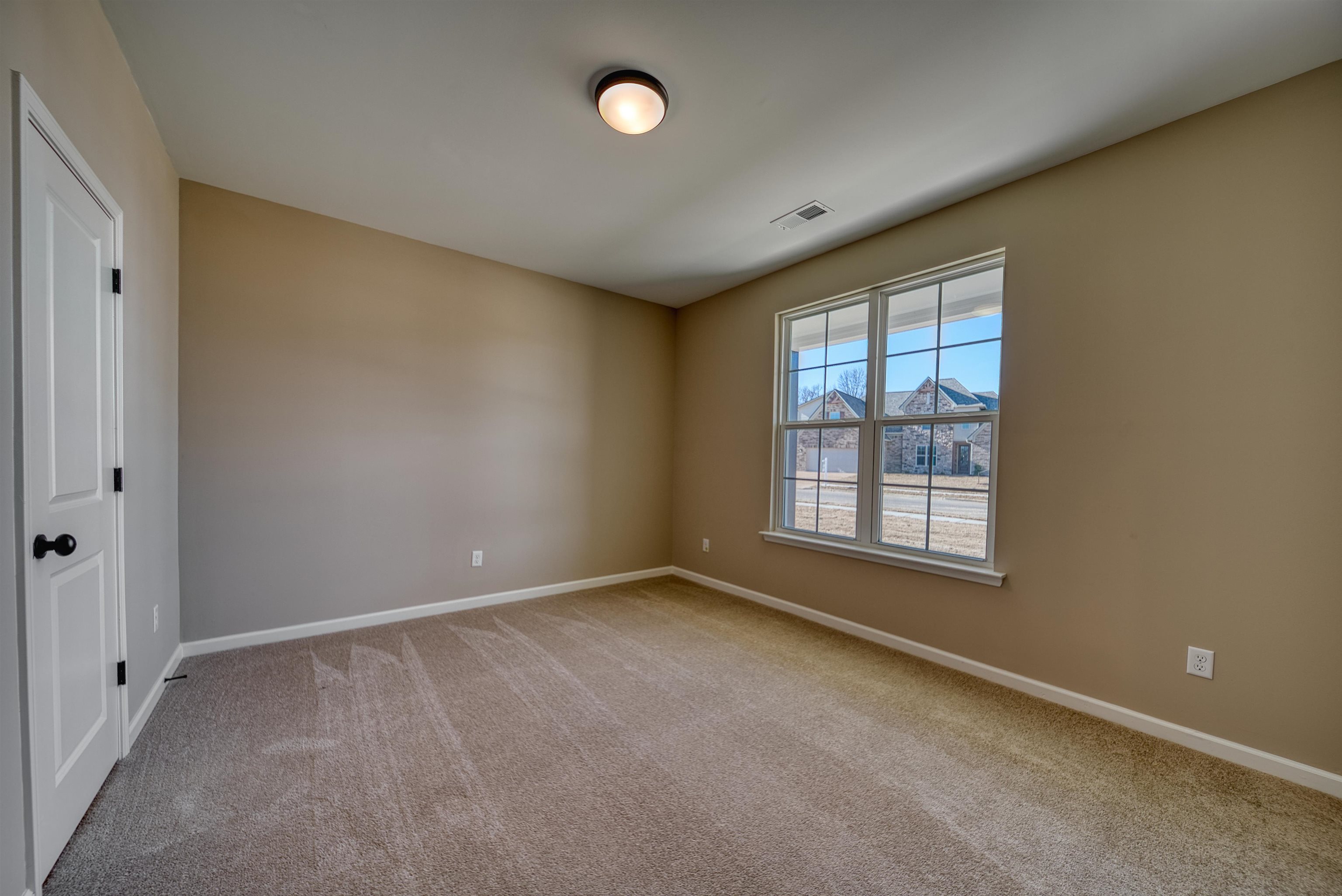 170 Como Lane Atoka, TN 38004 - Photo 9 of 40 Spare room featuring baseboards and light carpet