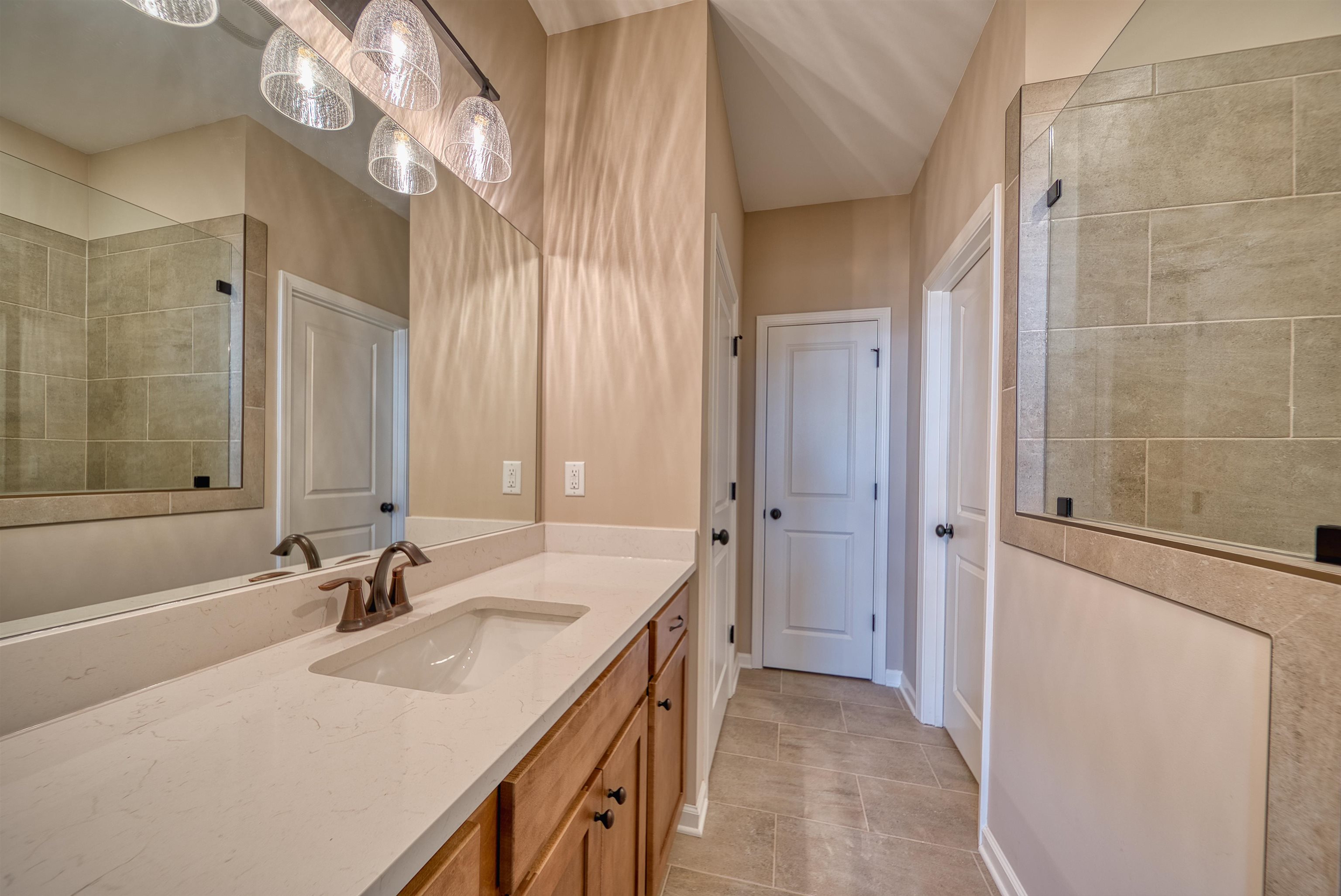 170 Como Lane Atoka, TN 38004 - Photo 10 of 40 Bathroom featuring vanity and a tile shower