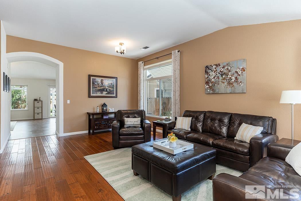 9778 Thunder Mountain Way Reno, NV 89521 - Photo 4 of 21 a living room with furniture and wooden floor