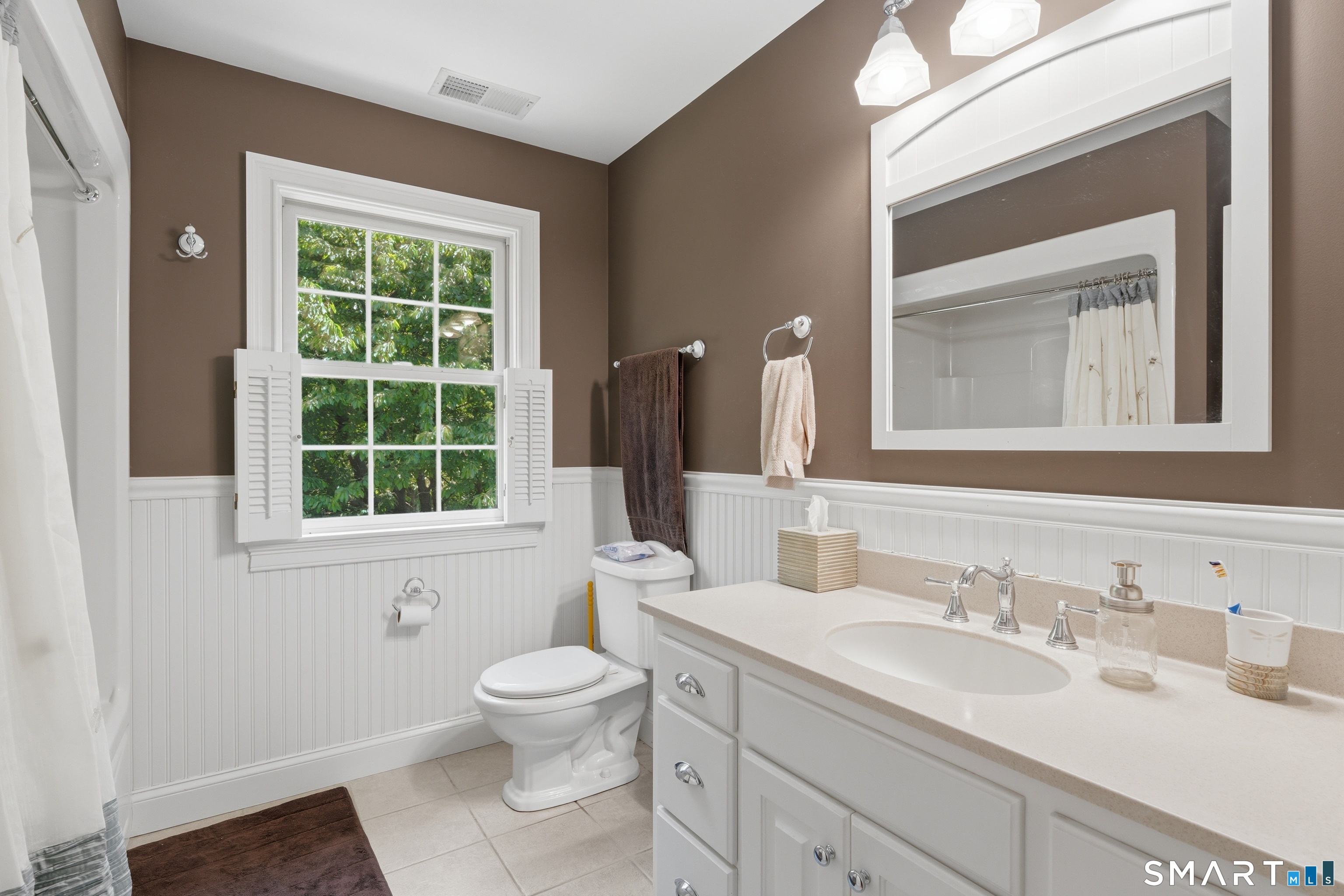 48 Case Road Burlington, CT 06013 - Photo 20 of 39 a bathroom with a toilet sink and mirror