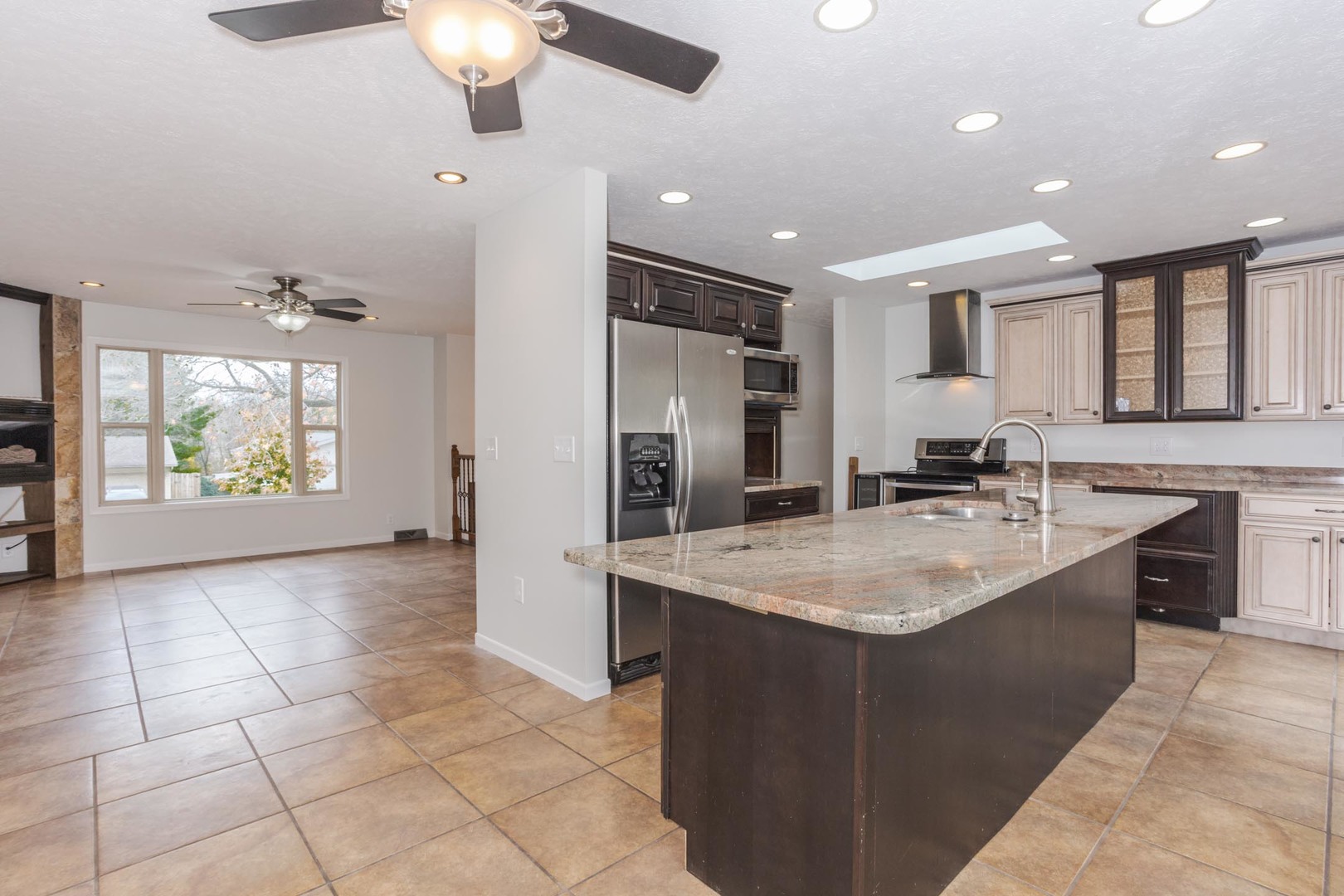 1308 Schroeder Drive Normal, IL 61761 - Photo 12 of 55 a large kitchen with kitchen island a sink stainless steel appliances and cabinets