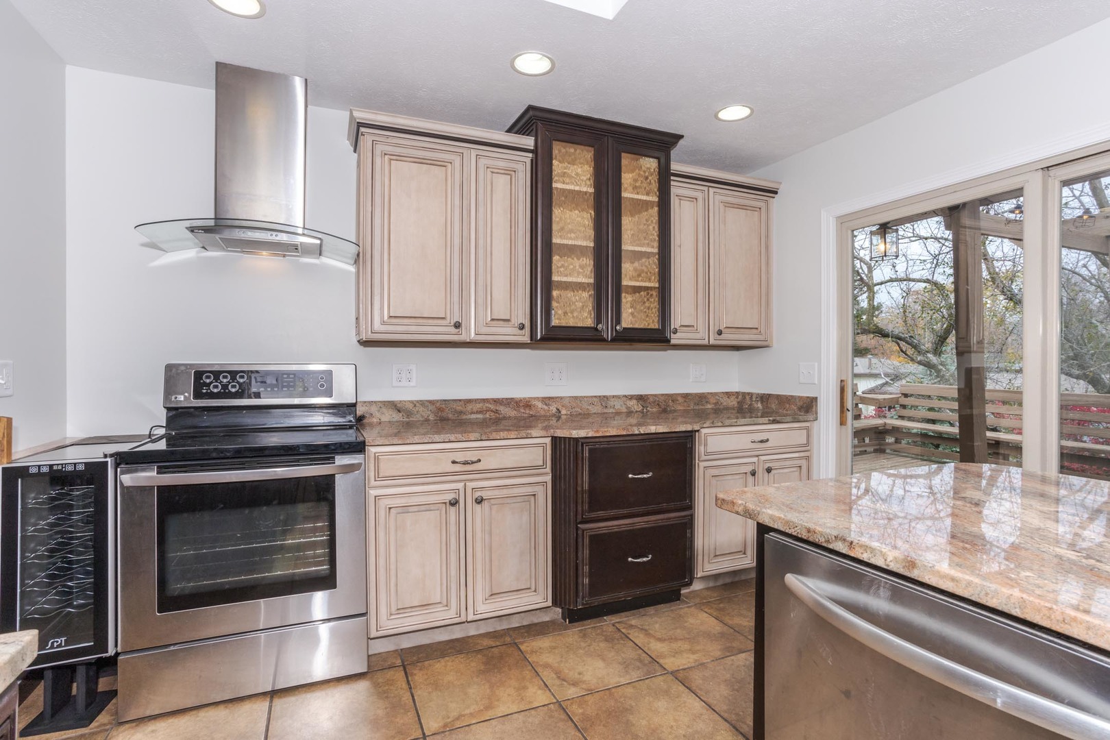 1308 Schroeder Drive Normal, IL 61761 - Photo 14 of 55 a kitchen with stainless steel appliances granite countertop a stove and a microwave