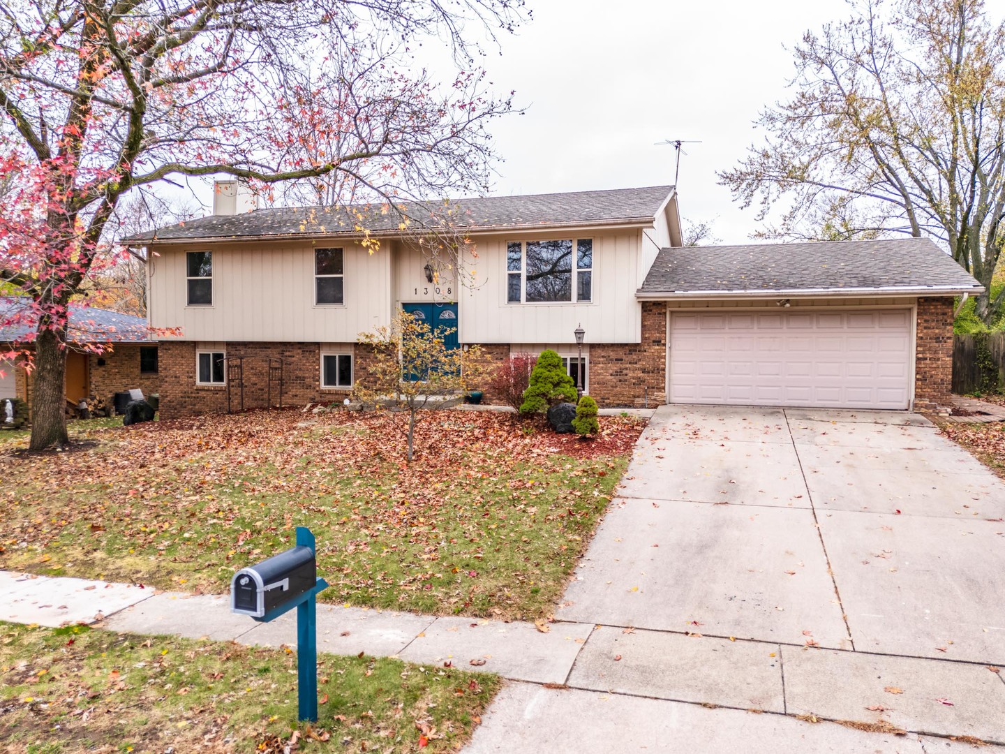 1308 Schroeder Drive Normal, IL 61761 - Photo 3 of 55 a front view of a house with garden