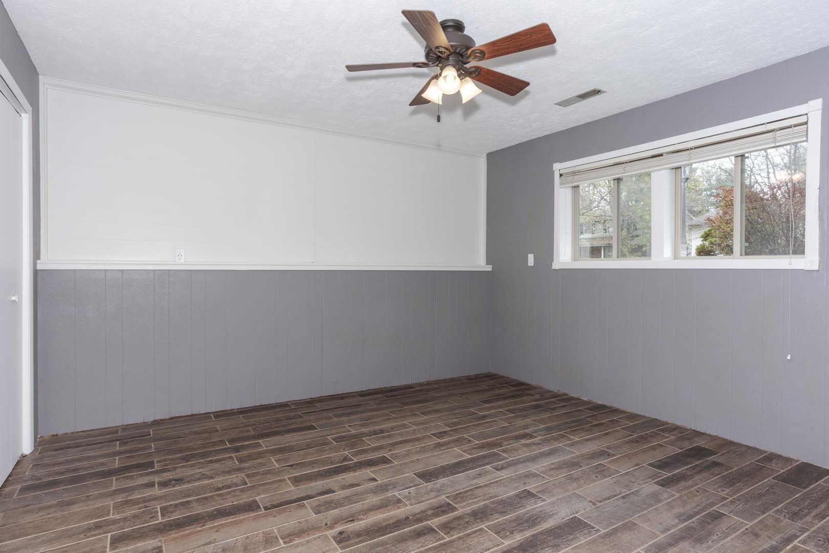 1308 Schroeder Drive Normal, IL 61761 - Photo 40 of 55 wooden floor in an empty room with a window