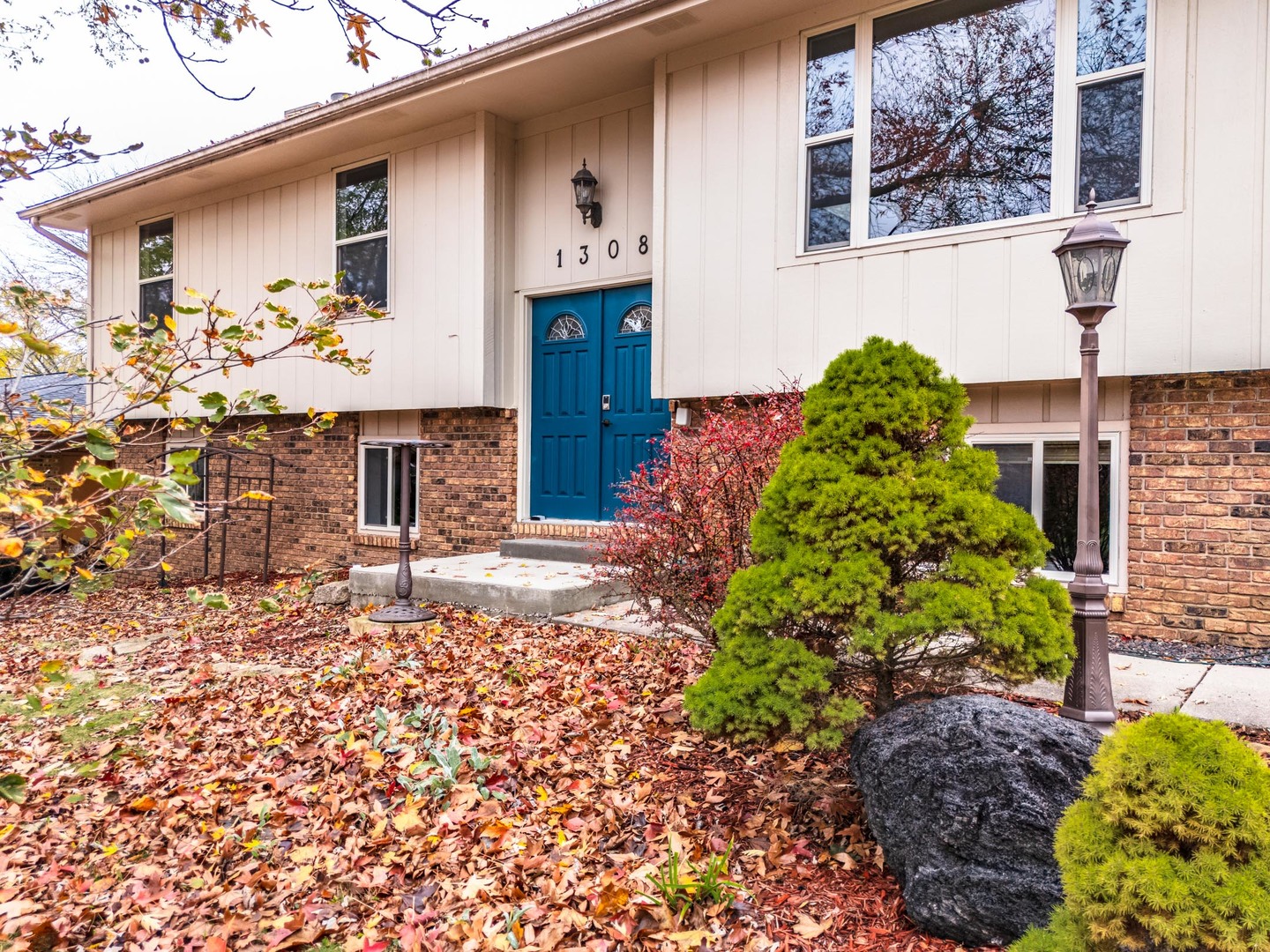 1308 Schroeder Drive Normal, IL 61761 - Photo 4 of 55 a front view of a house with garden