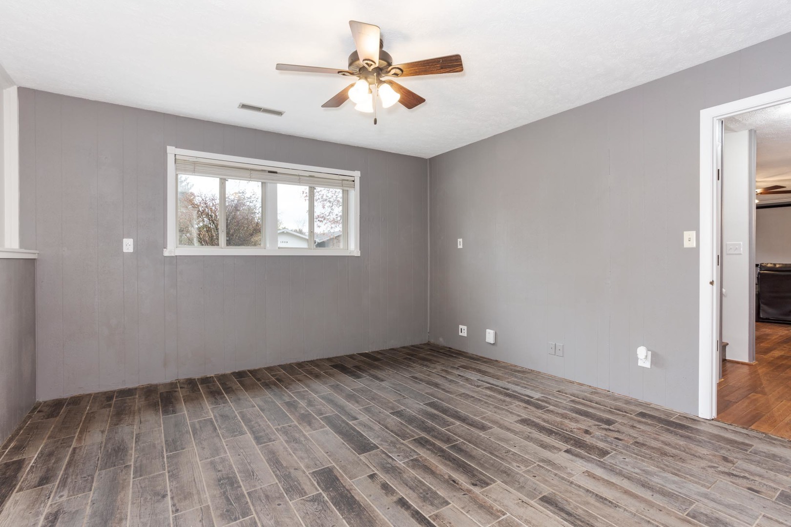 1308 Schroeder Drive Normal, IL 61761 - Photo 43 of 55 wooden floor in an empty room with a window