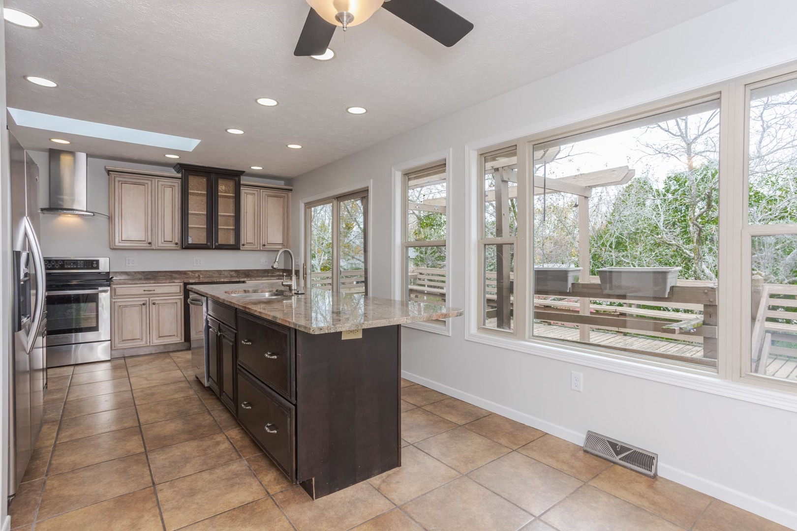 1308 Schroeder Drive Normal, IL 61761 - Photo 10 of 55 a kitchen with stainless steel appliances granite countertop a stove and a sink