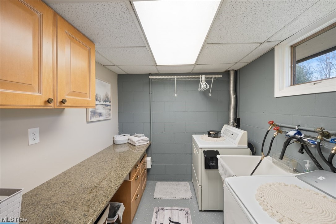 8221 Stone Road Medina, OH 44256 - Photo 26 of 35 Laundry area featuring cabinets and washer and dryer