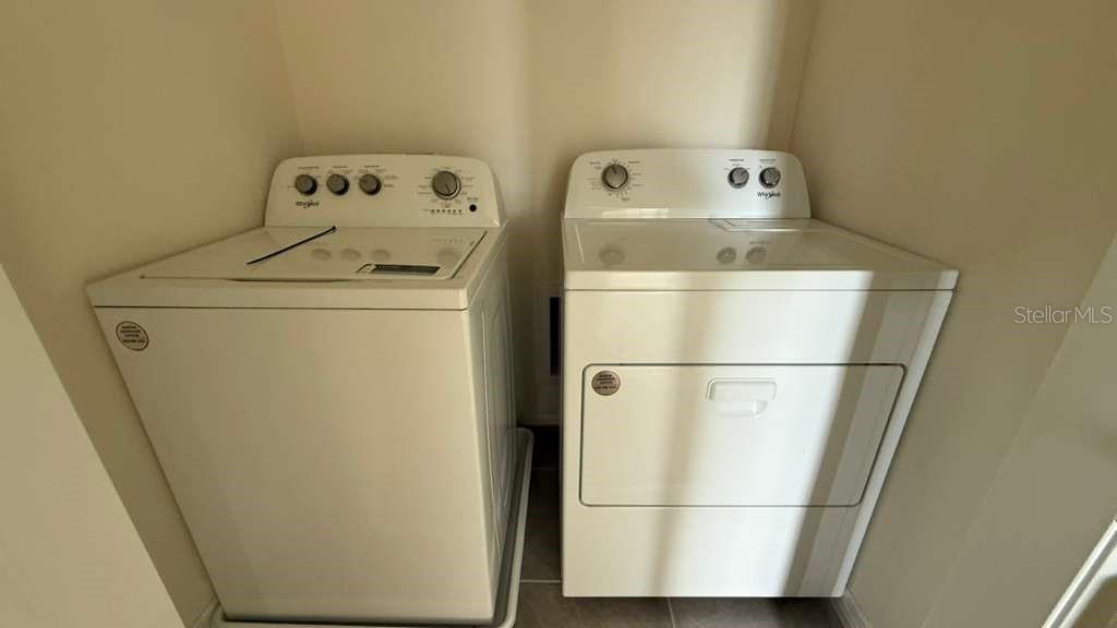 17061 Water Spring Boulevard Winter Garden, FL 34787 - Photo 16 of 17 a utility room with dryer and washer