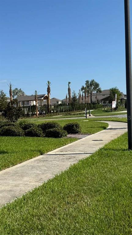 17061 Water Spring Boulevard Winter Garden, FL 34787 - Photo 2 of 17 a view of a park and trees in the background