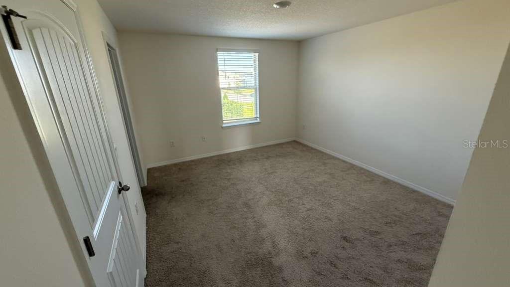 17061 Water Spring Boulevard Winter Garden, FL 34787 - Photo 9 of 17 an empty room with windows