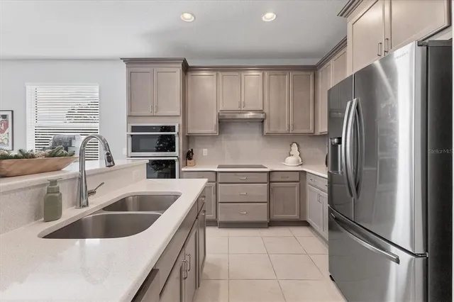 a kitchen with a sink and cabinets