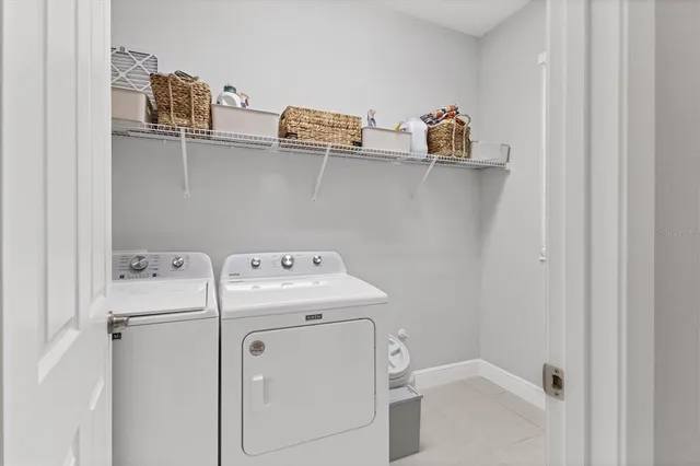 a view of a livingroom with storage and utility room