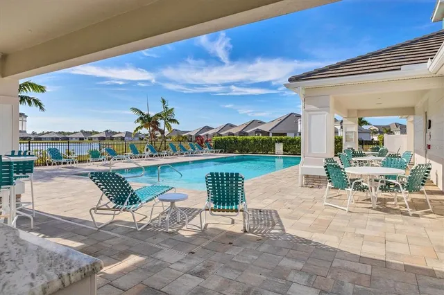 a view of swimming pool from a lounge chair