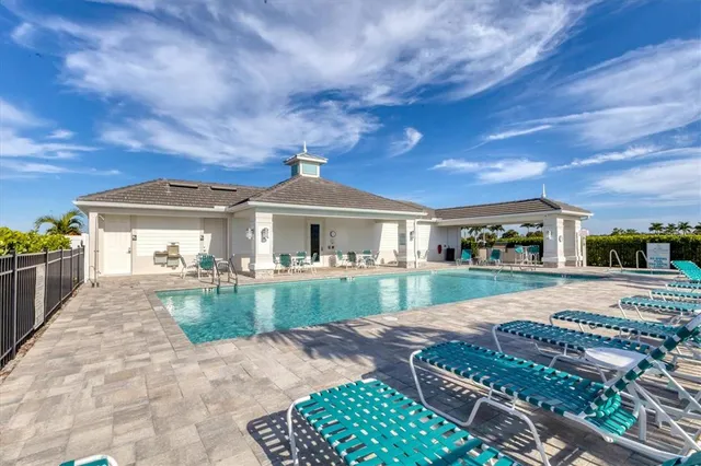 a view of a house with backyard porch and furniture