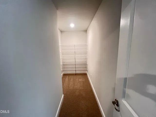 a view of a room with racks on the wall