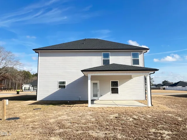 a view of swimming pool in front of house