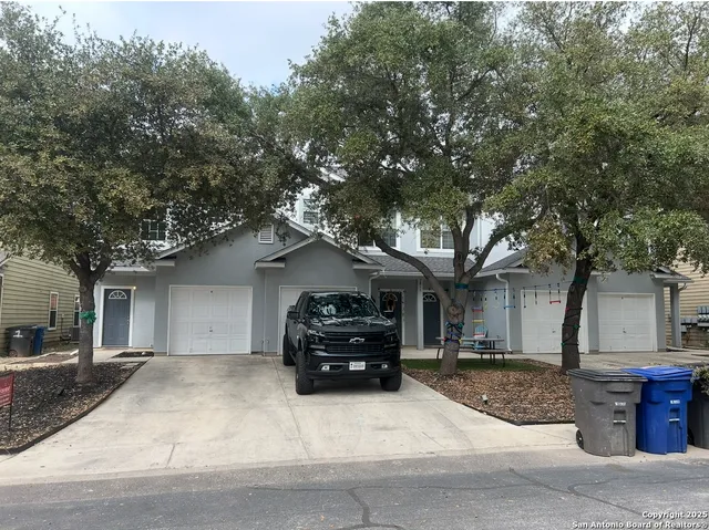 a car parked in front of white house