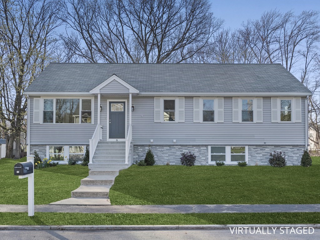 a front view of a house with a yard
