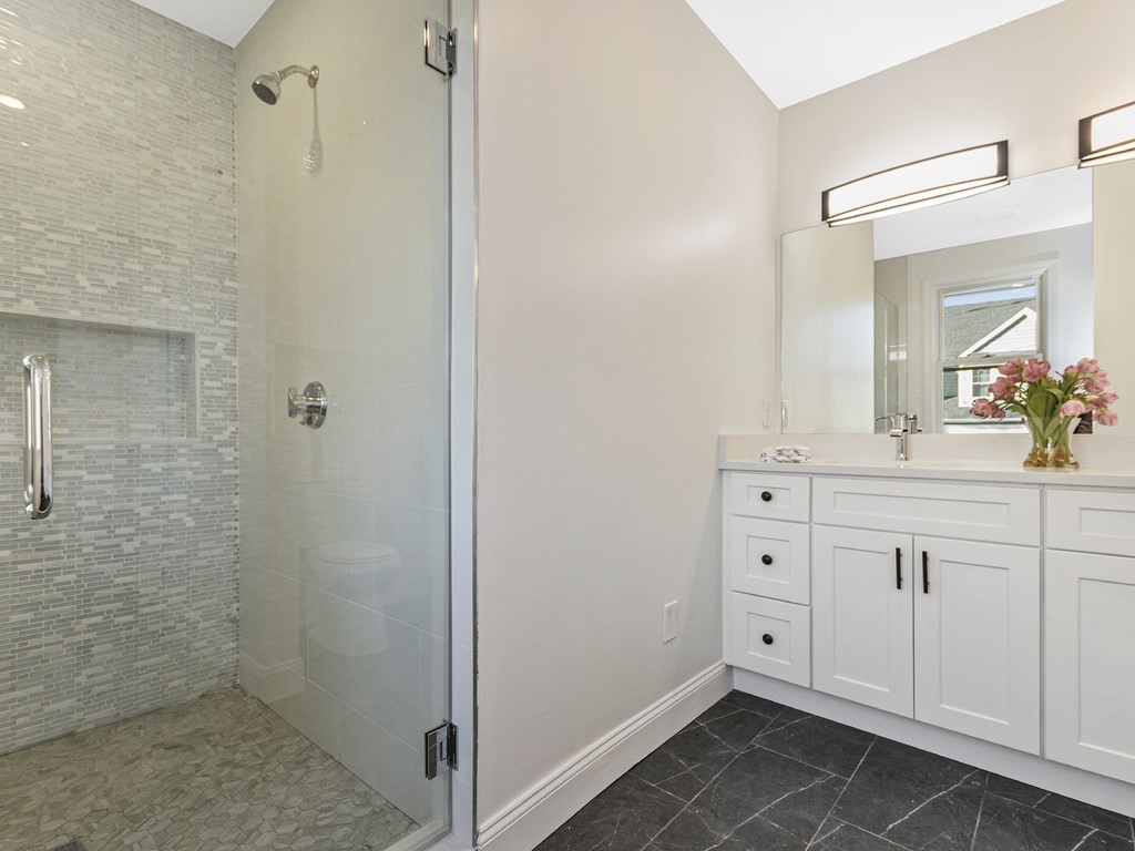33 Line Road Reading, MA 01867 - Photo 12 of 23 a bathroom with a sink and a mirror