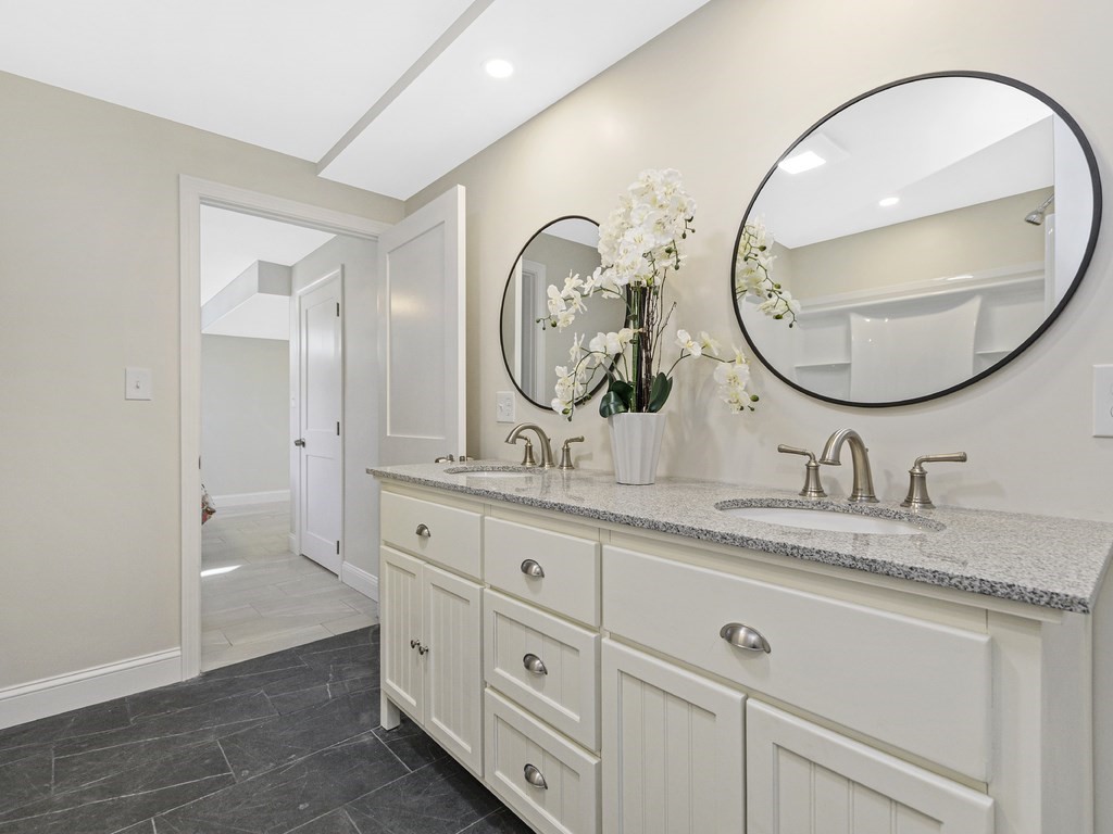 33 Line Road Reading, MA 01867 - Photo 18 of 23 a bathroom with a granite countertop sink and a mirror