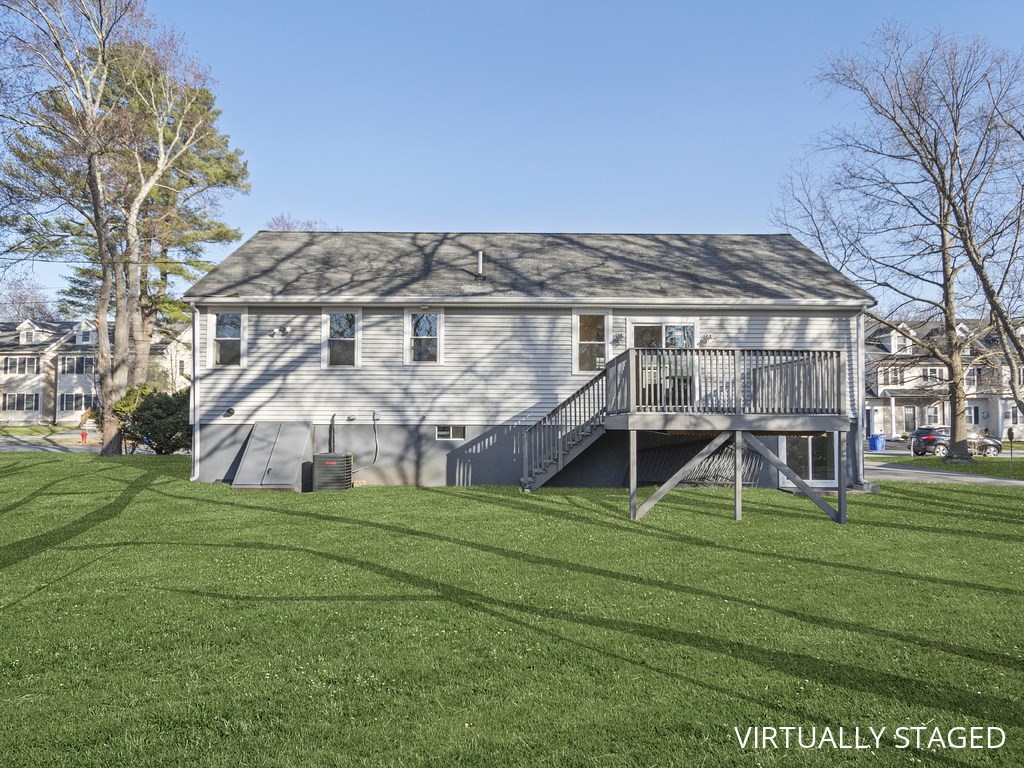 33 Line Road Reading, MA 01867 - Photo 20 of 23 a view of a house with a big yard and large trees