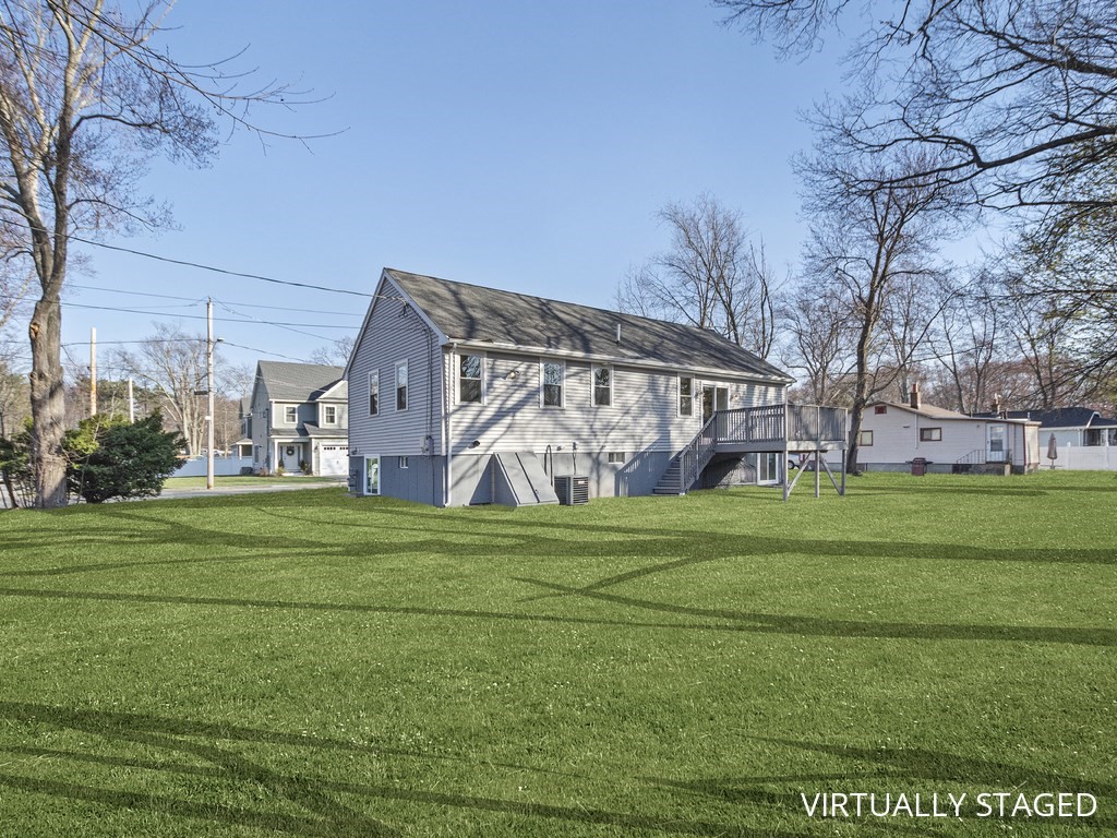 33 Line Road Reading, MA 01867 - Photo 21 of 23 a view of a house with a yard