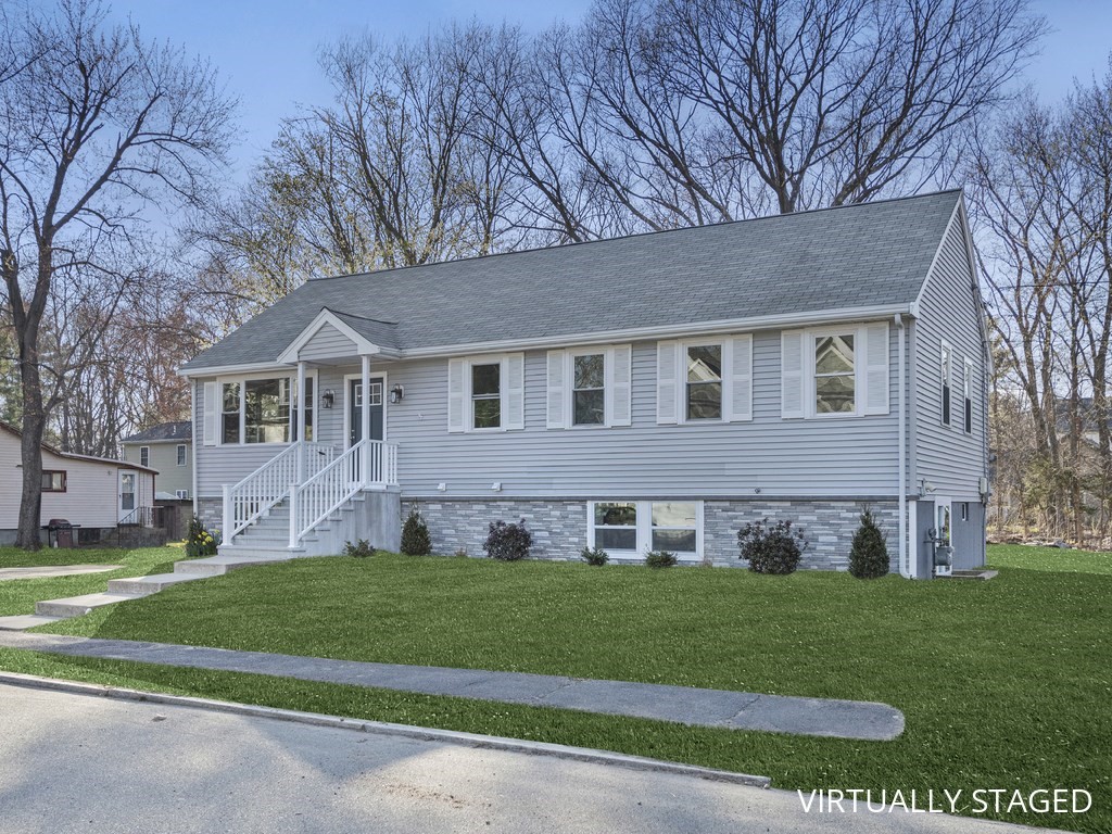 33 Line Road Reading, MA 01867 - Photo 22 of 23 a view of house with a yard