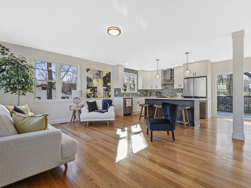 33 Line Road Reading, MA 01867 - Photo 5 of 23 a living room with furniture and kitchen view