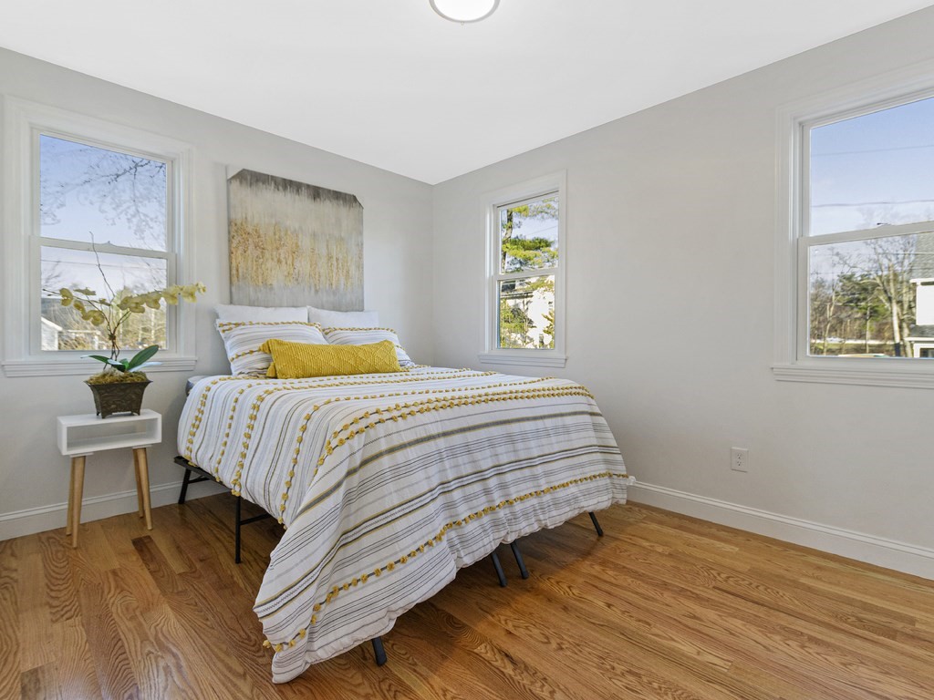 33 Line Road Reading, MA 01867 - Photo 10 of 23 a bedroom with a bed and painting on the wall