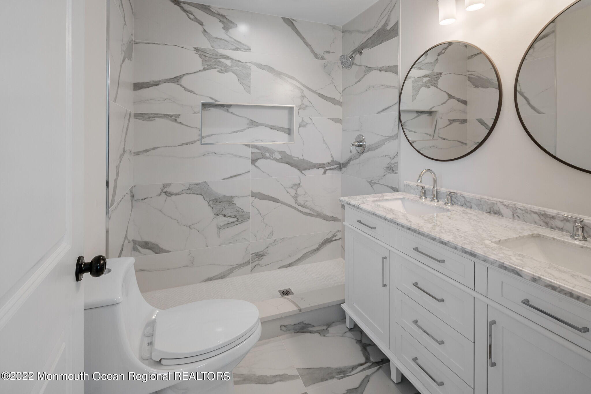 46 Beacon Lane Aberdeen, NJ 07747 - Photo 18 of 27 a bathroom with a granite countertop toilet sink and mirror