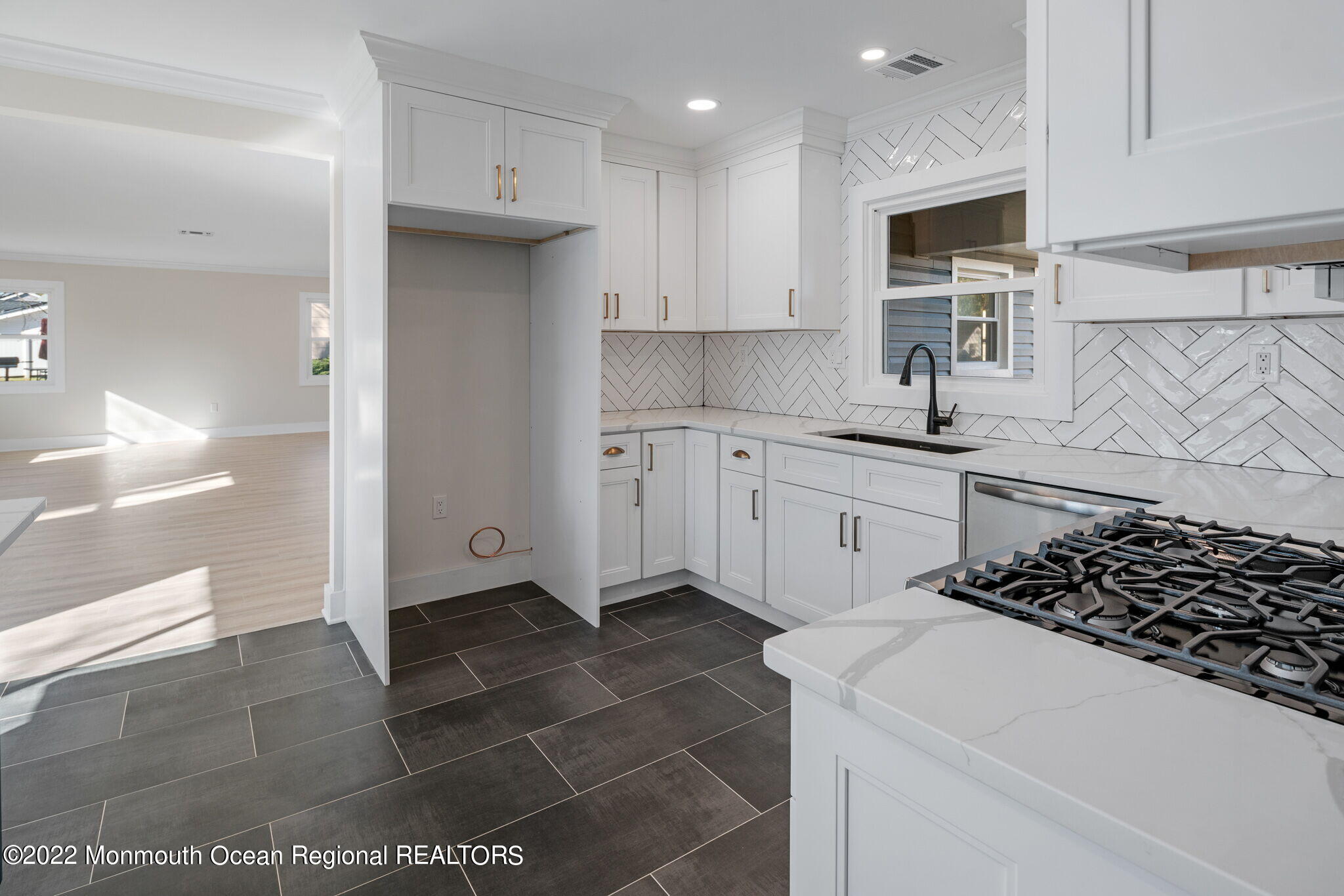 46 Beacon Lane Aberdeen, NJ 07747 - Photo 9 of 27 a kitchen with a sink a stove and refrigerator