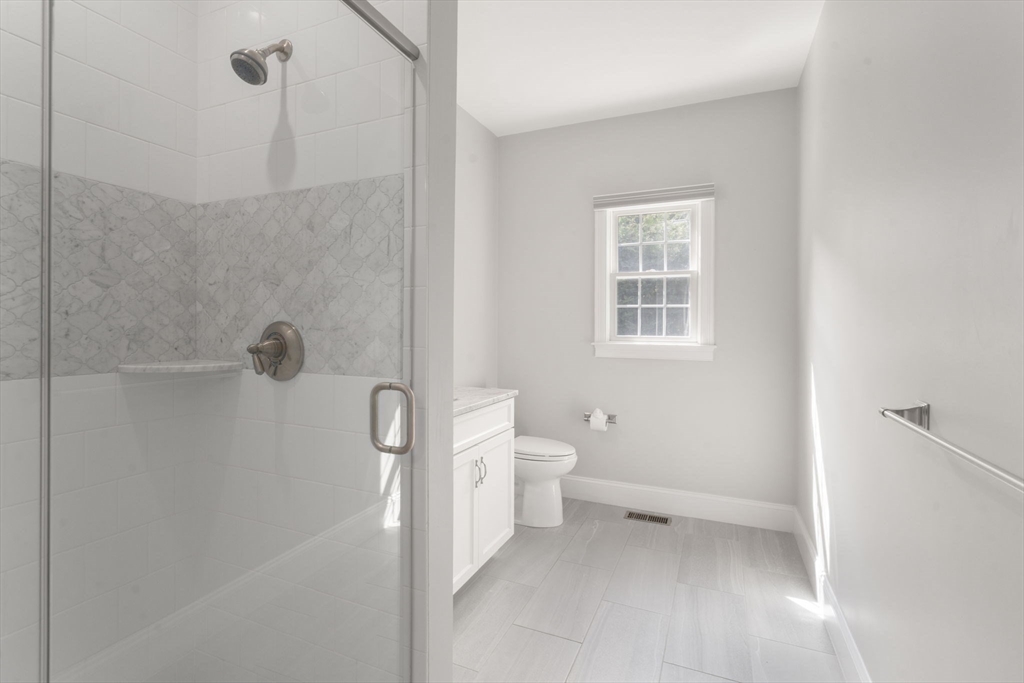173 Benvenue Street Wellesley, MA 02482 - Photo 13 of 34 a bathroom with a toilet sink and shower