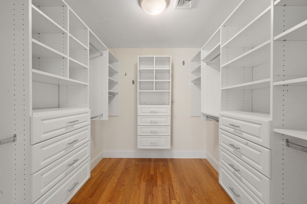 173 Benvenue Street Wellesley, MA 02482 - Photo 20 of 34 a view of walk in closet with empty racks