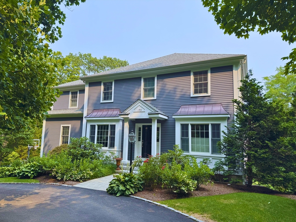 173 Benvenue Street Wellesley, MA 02482 - Photo 2 of 34 a front view of a house with a yard