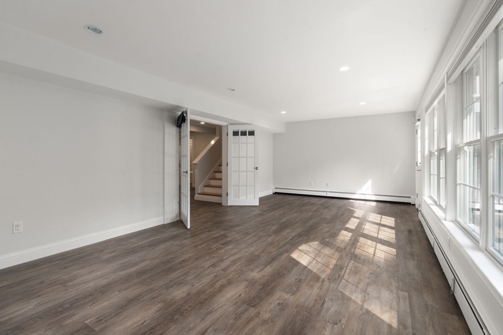 173 Benvenue Street Wellesley, MA 02482 - Photo 28 of 34 wooden floor in an empty room with a window